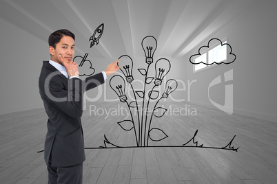 Composite image of thoughtful asian businessman pointing