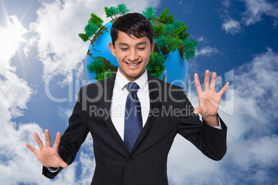 Composite image of smiling businessman touching