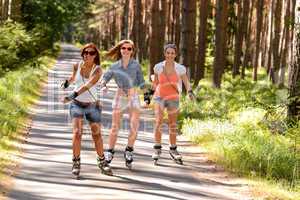 three friends on in-line skates outdoor