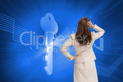 Composite image of businesswoman standing back to camera with ha