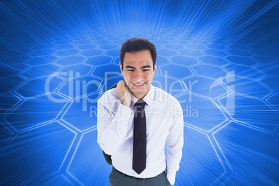 Composite image of smiling businessman standing