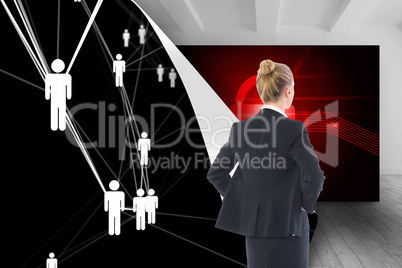 Composite image of businesswoman standing with hands on hips Composite image of businesswoman standing with hands on hips
