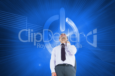 Composite image of smiling businessman standing