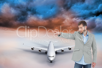 Composite image of trendy model pointing to something