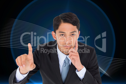 Composite image of thoughtful asian businessman pointing