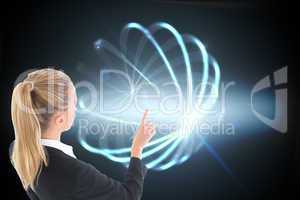 Composite image of businesswoman pointing somewhere