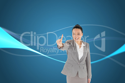 Composite image of smiling asian businesswoman pointing