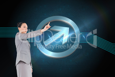 Composite image of unsmiling asian businesswoman pointing