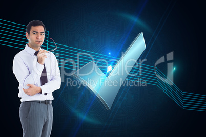 Composite image of unsmiling businessman holding glasses