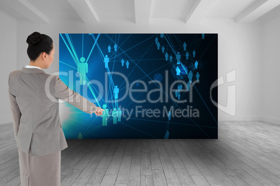 Composite image of asian businesswoman pointing