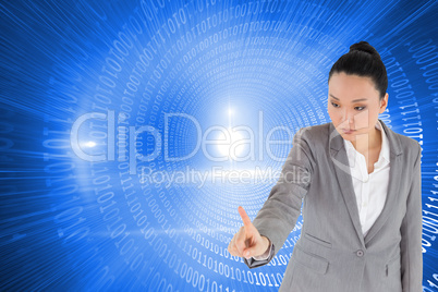 Composite image of unsmiling asian businesswoman pointing