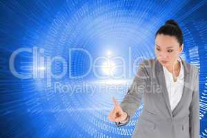 Composite image of unsmiling asian businesswoman pointing