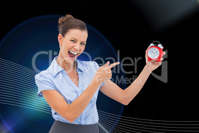 Composite image of businesswoman indicating alarm clock Composite image of businesswoman indicating alarm clock
