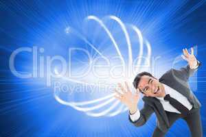 Composite image of excited businessman with arms raised