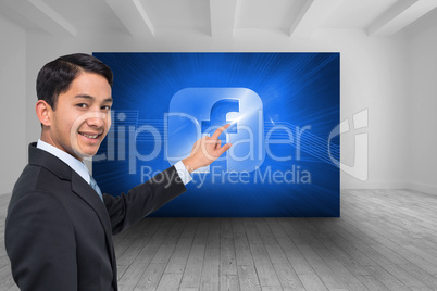 Composite image of smiling asian businessman pointing