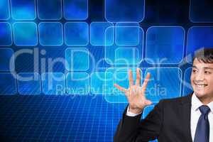 Composite image of smiling businessman holding and pointing