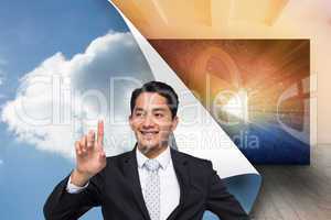 Composite image of smiling asian businessman pointing