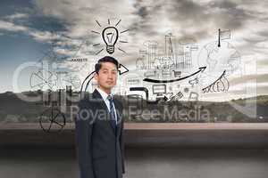 Composite image of serious asian businessman