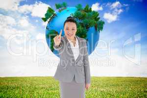 Composite image of smiling asian businesswoman pointing