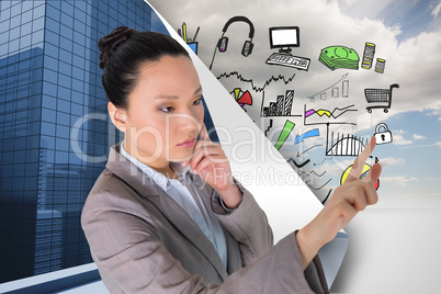 Composite image of thoughtful asian businesswoman pointing