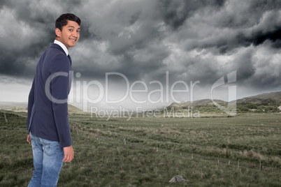 Composite image of smiling casual businessman walking