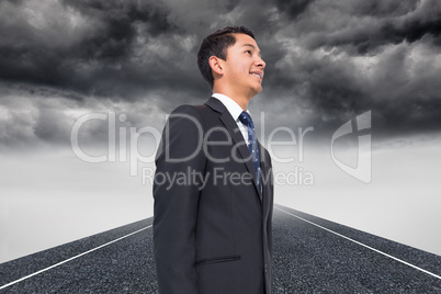 Composite image of stormy landscape background with street