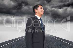 Composite image of stormy landscape background with street