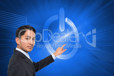 Composite image of stern asian businessman pointing
