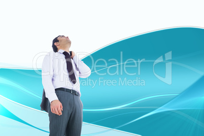 Composite image of unsmiling businessman standing