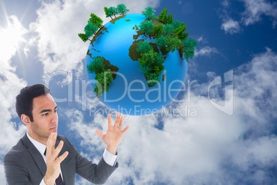 Composite image of unsmiling businessman with arms raised