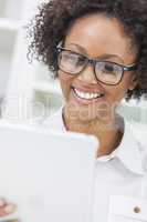 mixed race african american girl using tablet computer