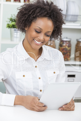 mixed race african american girl using tablet computer