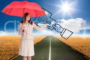 Composite image of attractive businesswoman holding red umbrella