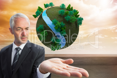 Composite image of concentrated businessman with palm up