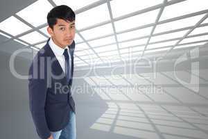 Composite image of unsmiling casual businessman walking