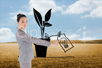 Composite image of unsmiling asian businesswoman pointing