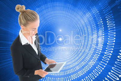 Composite image of businesswoman holding new tablet