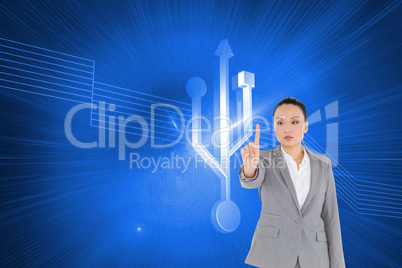 Composite image of unsmiling asian businesswoman pointing