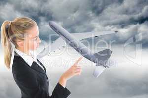 Composite image of businesswoman pointing somewhere