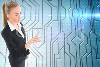 Composite image of businesswoman pointing somewhere