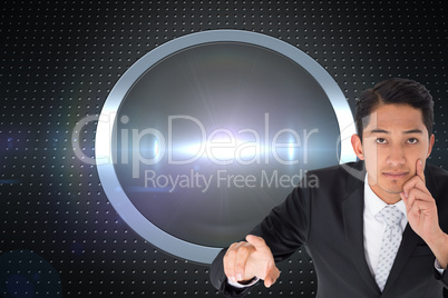 Composite image of thoughtful asian businessman pointing