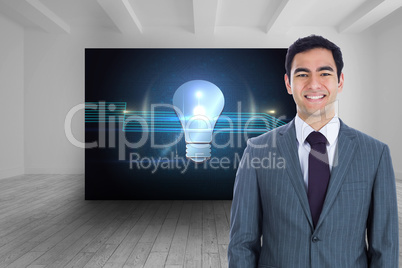 Composite image of smiling businessman standing