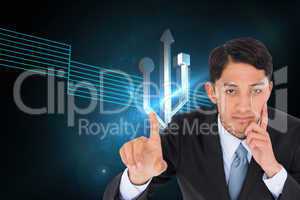 Composite image of thoughtful asian businessman pointing