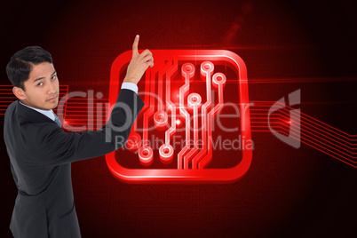 Composite image of stern asian businessman pointing