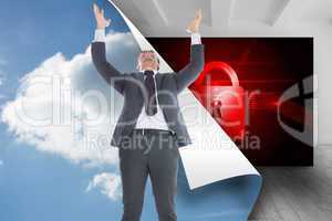 Composite image of businessman with arms raised