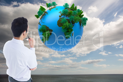 Composite image of businessman holding glasses