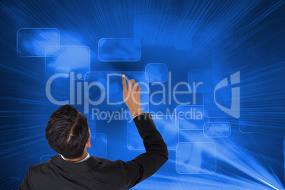 Composite image of asian businessman pointing