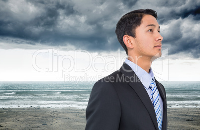 Composite image of serious asian businessman