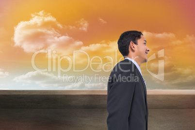 Composite image of smiling asian businessman