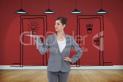 Composite image of businesswoman holding tablet computer